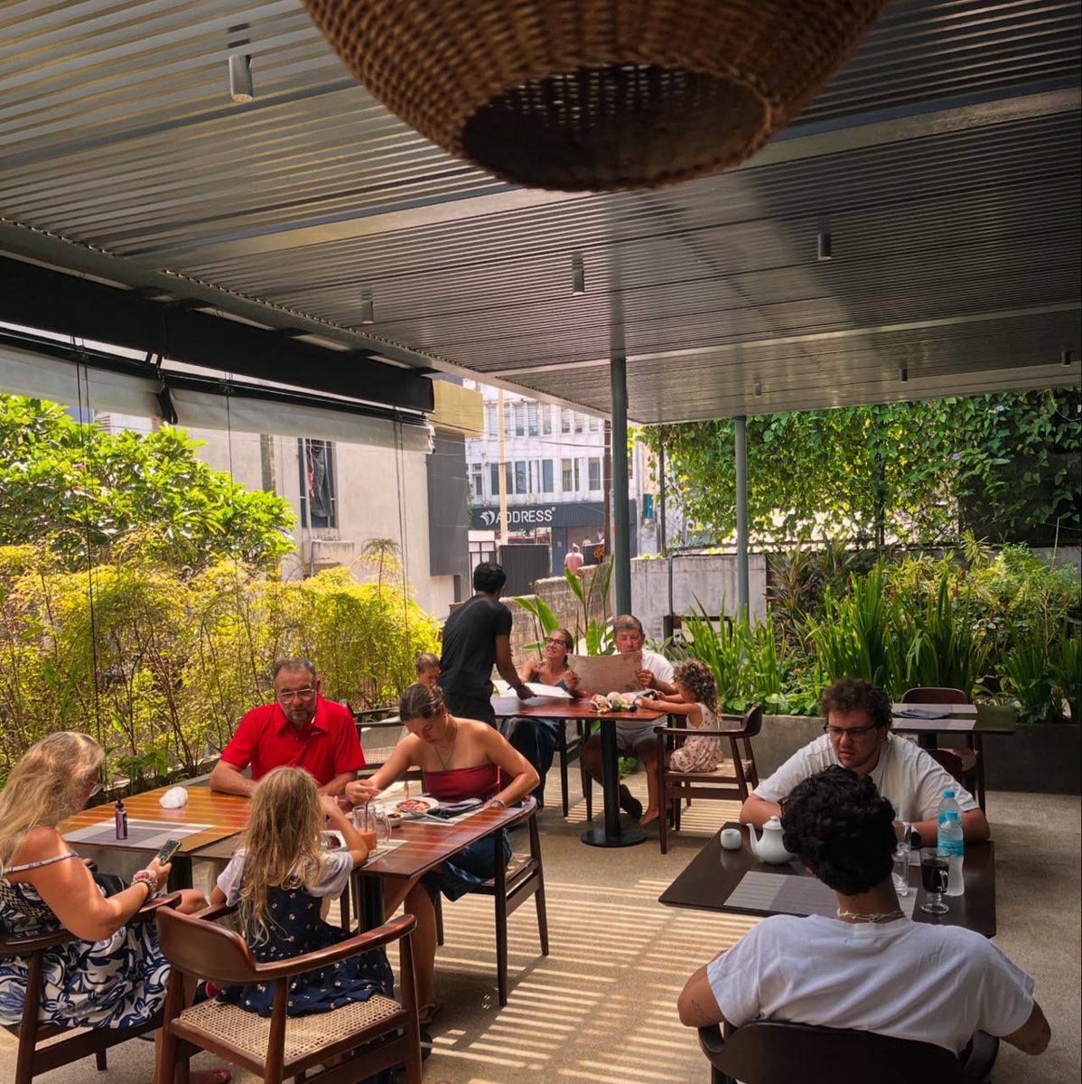 Guests enjoying a long lunch on the Taprobane Table terrace