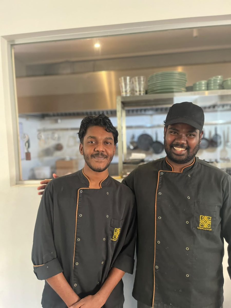 Two Taprobane House chefs in front of the kitchen pass